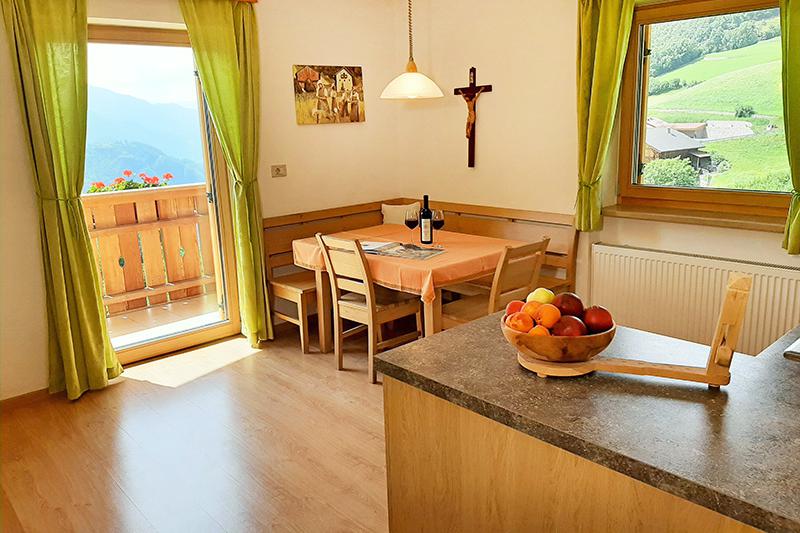 Kitchen with dining area and balcony access